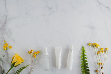 cosmetic skincare packaging . beauty product mock up on luxury white marble with natural light and shadow.