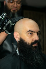 Latin American barber working the style with a long beard in the city of Bogotá.