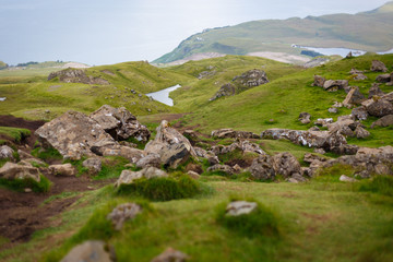 Fototapeta na wymiar Detail on fallen rocks from iconic rock formation located on the Isle of Skye, near Portree, Scotland, UK
