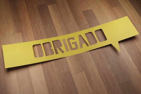 Banner with the word "obrigado" in speech bubble. Thank you in brazilian portuguese. 3D Render