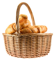 Fresh backed croissant in basket isolated on white background