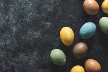 Easter background. Homemade natural diyed easter eggs and space for a text