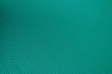 Leather texture close up. Aquamarine fashionable background, top view. Stylish wallpaper of snake skin. Rough surface of sea wave color.