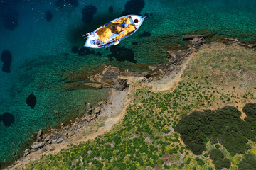 Fototapeta na wymiar Aerial drone photo of beautiful traditional fishing boat in island of Crete at spring, Greece