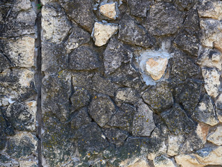 texture of the old gray masonry of gray stones of various shapes