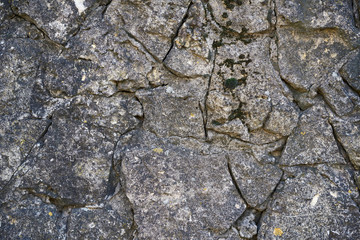 texture of the old gray masonry of gray stones of various shapes