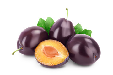 fresh purple plum and half with leaves isolated on white background with clipping path and full depth of field