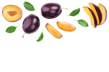 fresh purple plum and half with leaves isolated on white background with clipping path and copy spase for your text. Top view. Flat lay