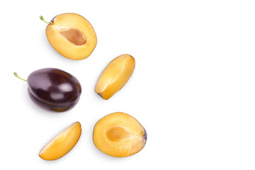 fresh purple plum and half isolated on white background with clipping path and copy spase for your text. Top view. Flat lay