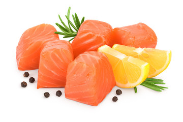 raw salmon piece cube with rosemary, lemon and peppercorn isolated on white background close up