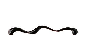 Wavy line painted with chocolate syrup on white background