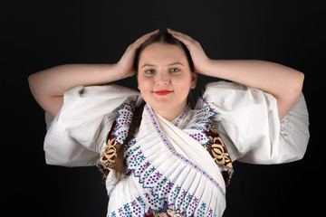 Young beautiful slovak woman in traditional costume. Slovak folklore.