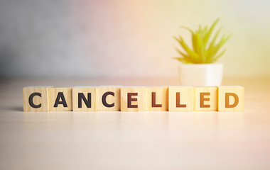 CANCELLED word made with building blocks, business concept.