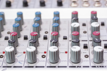 Audio sound mixer and amplifier equipment, sound acoustic musical mixing engineering concept background, selective focus.