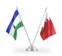 Bahrain and Lesotho table flags isolated on white 3D rendering