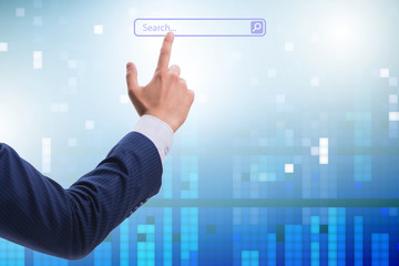 Search concept with businessman pressing button