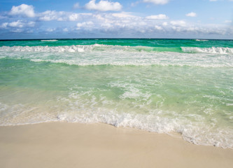 Turquoise water flowing over the shore