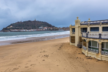 La Concha beach in San Sebastian city also called Donostia in Basque Country, Spain - view with Mount Urgull on background