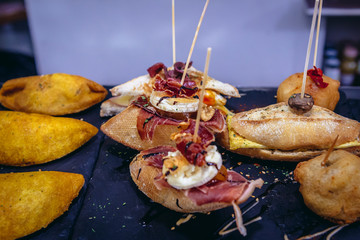 Fototapeta premium Varieties of snacks called pinchos in bar in San Sebastian city also called Donostia in Basque Country, Spain