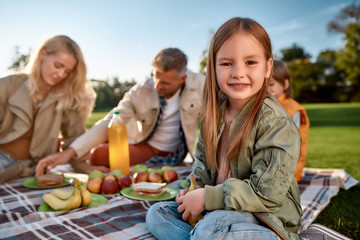 Happy weekend. Happy family spending time in the park on a sunny day