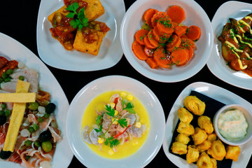 spanish tapas. tapa is an appetizer or snack in Spanish cuisine and translates to small portion of any kind of Spanish cuisine, marinated carrot,seafood,calamari etc