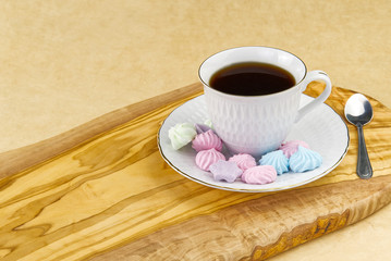 Obraz premium breakfast, coffee with bize cookies on olive wood board
