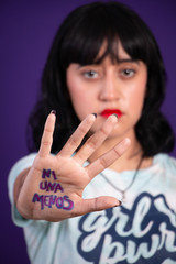 Young hispanic woman campaigning against gender based violence