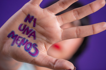 Young hispanic woman campaigning against gender based violence