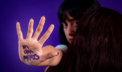 Young hispanic woman campaigning against gender based violence