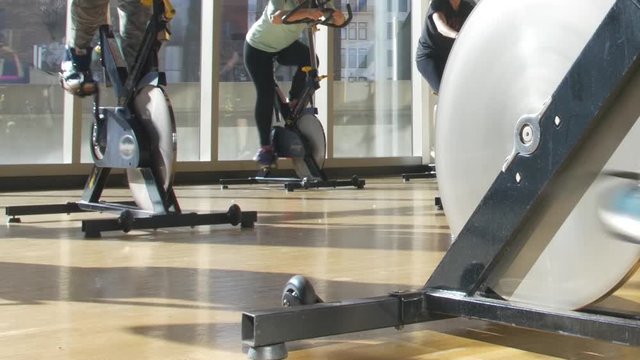 Cycling Class With Beautiful Sunlight and City Backdrop Bicycle Gym