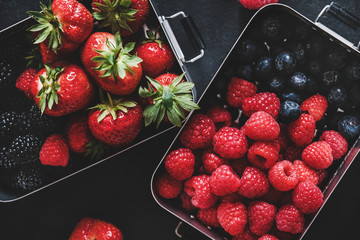 Healthy summer vegan lunch. Flat-lay of fresh seasonal strawberries, raspberries, blueberries,...