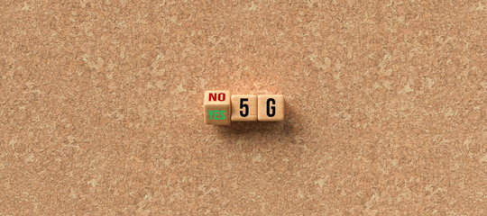 cubes with the text 5G and the option between NO and YES on cork background