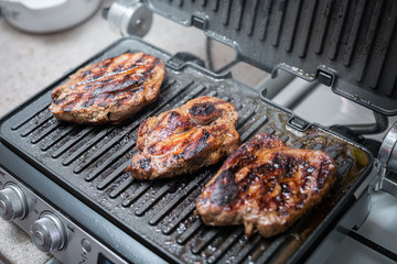 Steaks on the electric grill.