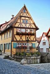 Rothenburg ob der Tauber in Bavaria, Germany is well known for its well-preserved medieval old town, a destination for tourists from around the world. 