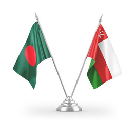 Oman and Bangladesh table flags isolated on white 3D rendering