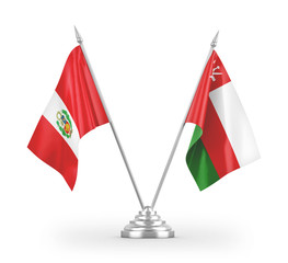 Oman and Peru table flags isolated on white 3D rendering