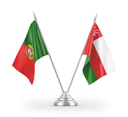 Oman and Portugal table flags isolated on white 3D rendering