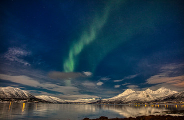 Northern lights under a full moon