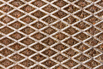 Metal grid walkway. Grunge steel mesh texture. Heavy iron backdrop pattern. Industrial grate design...