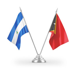 East Timor and Nicaragua table flags isolated on white 3D rendering