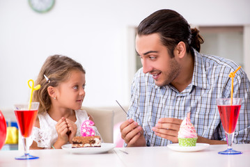 Father celebrating birthday with his daughter