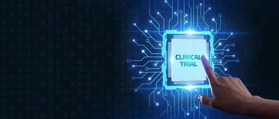 Business, Technology, Internet and network concept. Business man working on the tablet of the future, select on the virtual display: Clinical trial