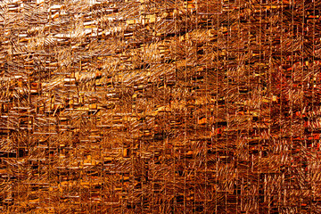 Copper or orange colored glass texture background with textures of different shades of copper