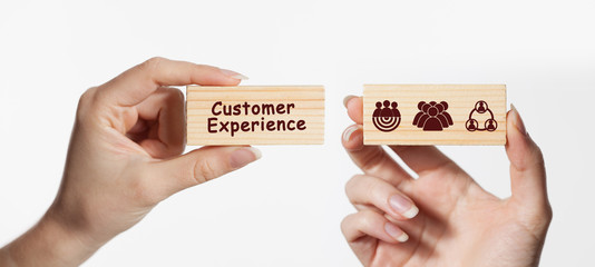 Business, Technology, Internet and network concept. Technology future. Young businessman, working on the smartphone of the future, clicks on the virtual display button: Customer Experience.