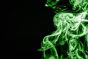 Green smoke isolated on black. Gas flow shape effect. Artistic color scent mist background. Empty...