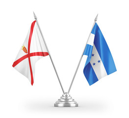 Honduras and Jersey table flags isolated on white 3D rendering