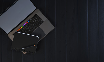 3d render mockup laptop and notebook on black wood table background