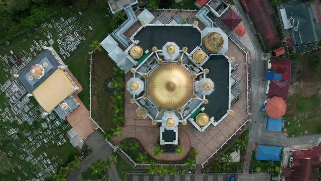 Aerial view of the beautiful Ubudiah Mosgue with golden dome in Kuala Kangsar, Perak, Malaysia