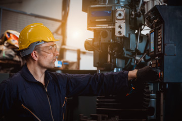 The Industry engineering wearing safety uniform control operating computer controlled Lathe...