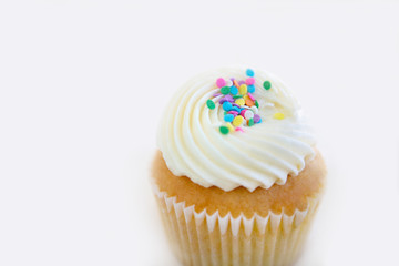 closeup birthday cupcake on white background